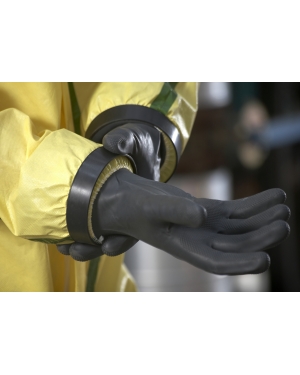 Person wearing protective gloves and yellow hazmat suit.