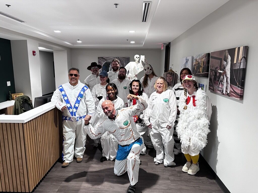 Group in creative Halloween costumes indoors